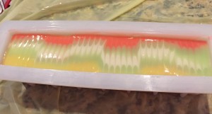 I poured the soap from one end of the mold and let it flow, then used a comb for the top. I liked this effect.